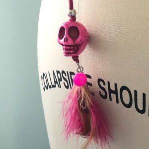 Long hot pink skull and feather necklace